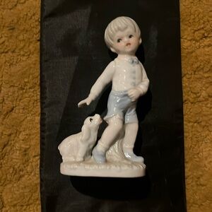 Vintage KPM porcelain young boy with puppy figurine